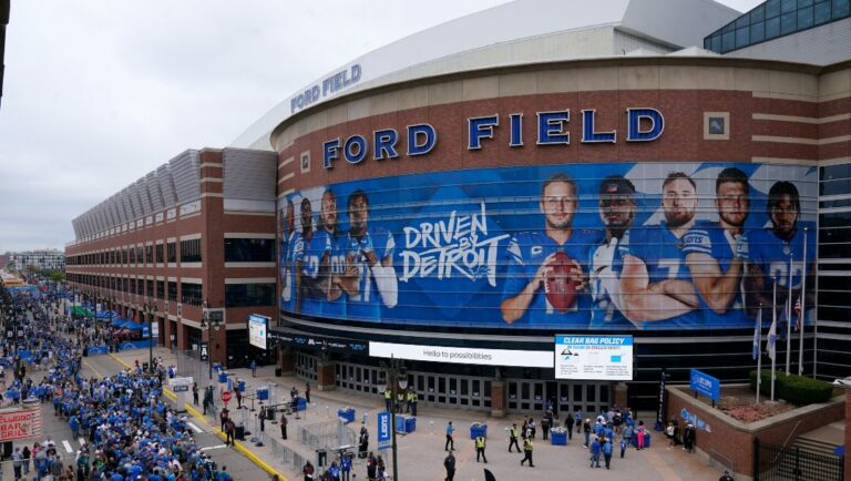 Fans arrive at Ford Field before an NFL football game between the Detroit Lions and Philadelphia Eagles in Detroit, Sunday, Sept. 11, 2022.
