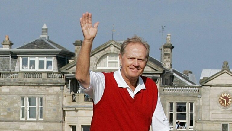 Jack Nicklaus waves from the Swilcan Bridge during the final round of the British Open Golf Championship, on the Old Course at St. Andrews, Scotland, July 15, 2005.