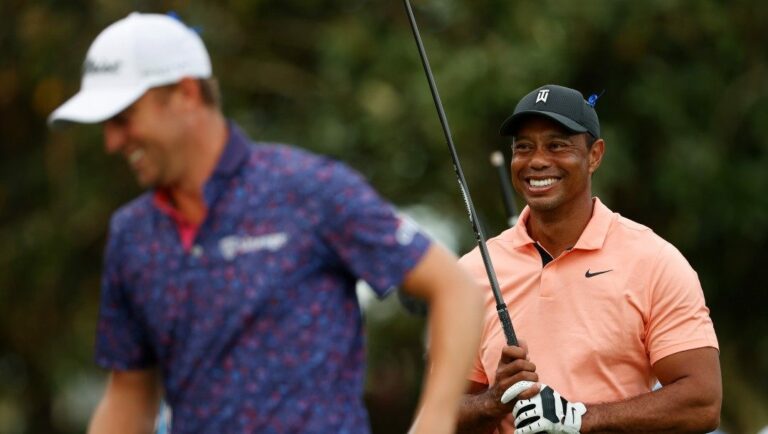 Tiger Woods, right, laughs with Justin Thomas during the first round of the PNC Championship golf tournament Saturday, Dec. 18, 2021, in Orlando, Fla.