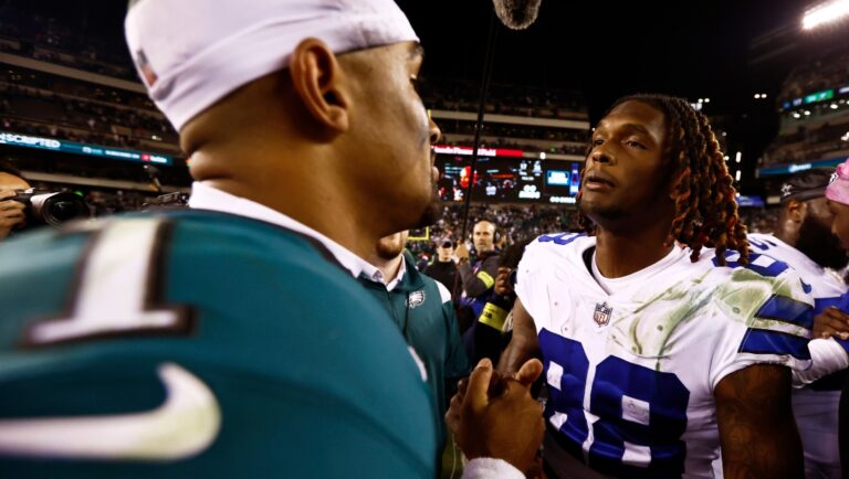 Philadelphia Eagles quarterback Jalen Hurts (1) talks with Dallas Cowboys wide receiver CeeDee Lamb (88)