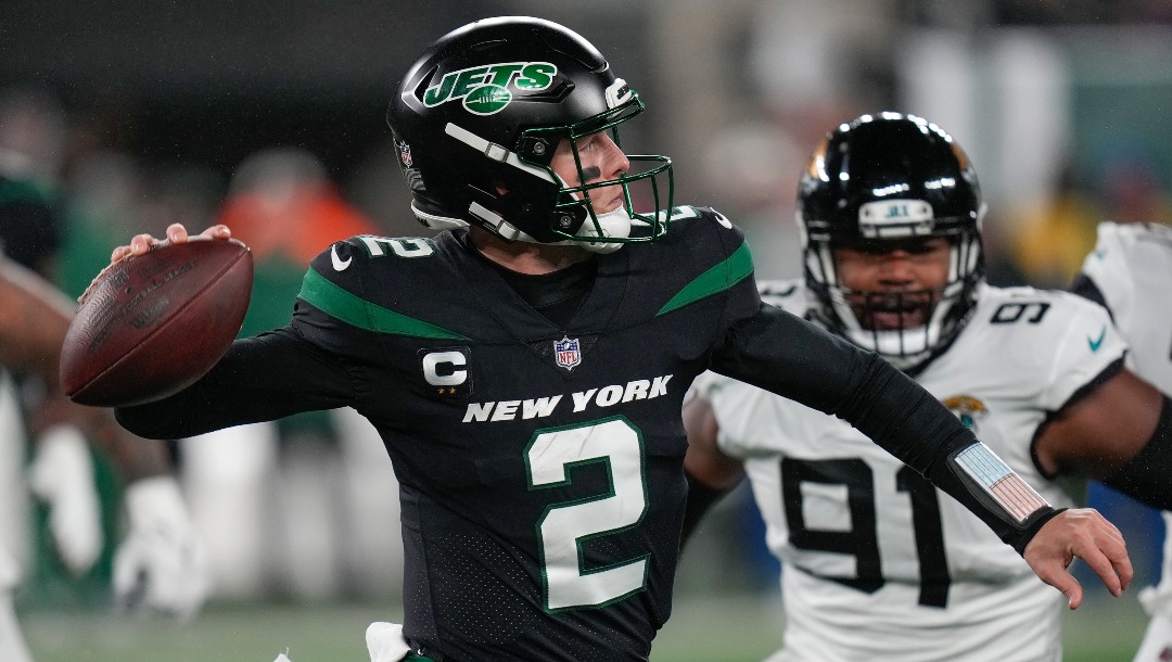New York Jets quarterback Zach Wilson (2) passes against the Jacksonville Jaguars during the first quarter of an NFL football game, Thursday, Dec. 22, 2022, in East Rutherford, N.J. (AP Photo/Seth Wenig)