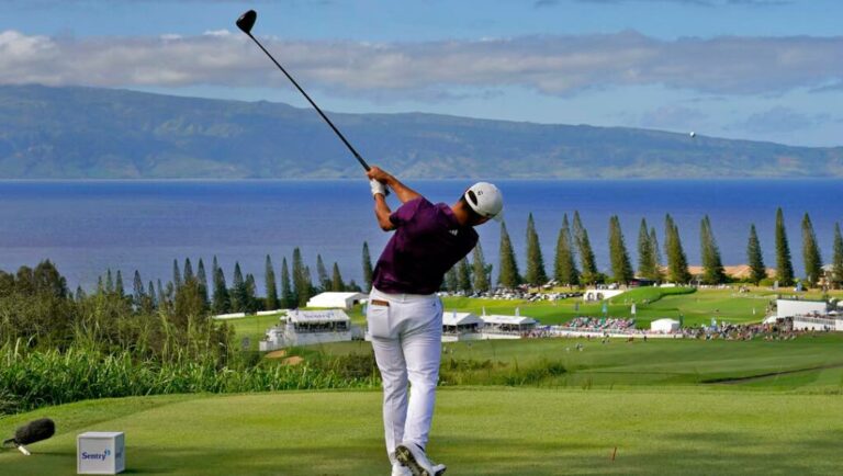 Collin Morikawa plays his shot from the 18th tee during the third round of the Tournament of Champions golf event, Saturday, Jan. 7, 2023, at Kapalua Plantation Course in Kapalua, Hawaii.