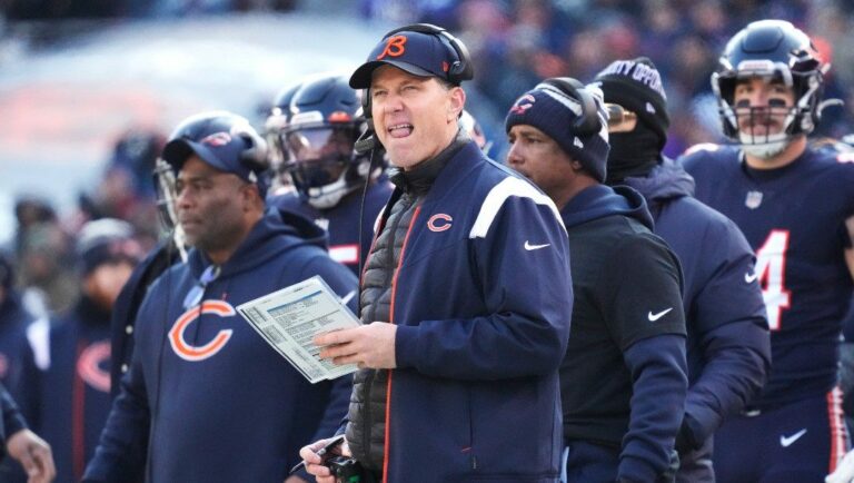 Chicago Bears head coach Matt Eberflus checks a score board during the second half of an NFL football game against the Minnesota Vikings, Sunday, Jan. 8, 2023, in Chicago. The Vikings won 29-13.