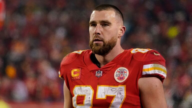 Kansas City Chiefs tight end Travis Kelce watches from the sideline during an NFL Divisional Playoff football game against the Jacksonville Jaguars Saturday, Jan. 21, 2023, in Kansas City, Mo.