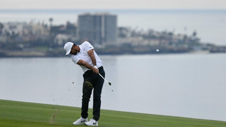Jason Day hits his second shot on the fourth hole of the South Course during the final round of the Farmers Insurance Open golf tournament, Saturday, Jan. 29, 2022, in San Diego.