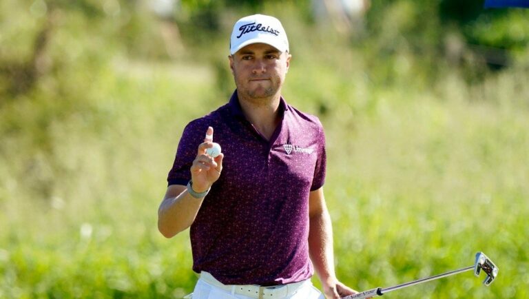 Justin Thomas waves after making birdie on the first green during the final round of the Tournament of Champions golf event, Sunday, Jan. 9, 2022, at Kapalua Plantation Course in Kapalua, Hawaii.