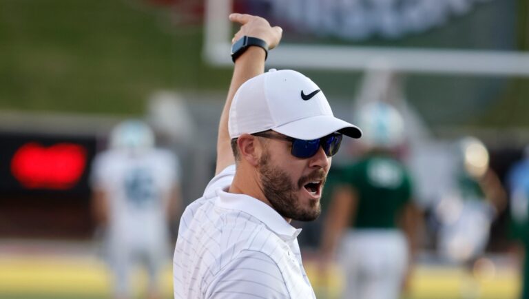 SMU offensive coordinator Garrett Riley directs players prior to playing Tulane during an NCAA college football game in Dallas, Thursday, Oct. 22, 2021. (AP Photo/Michael Ainsworth)