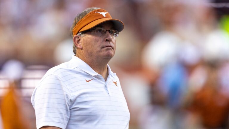 FILE - Gary Patterson, special assistant to the Texas football coach, walks the sideline at the team's NCAA college football game against West Virginia on Saturday, Oct. 1, 2022, in Austin, Texas. Gary Patterson could now play a key role in spoiling what has been a perfect season so far for fourth-ranked TCU. After having as good a run as any Big 12 coach in whipping Texas over the past decade while still in purple, there is that startling contrast of Patterson being in burnt orange and on the opposite side of the team that he led to its last undefeated season. (AP Photo/Stephen Spillman, File)
