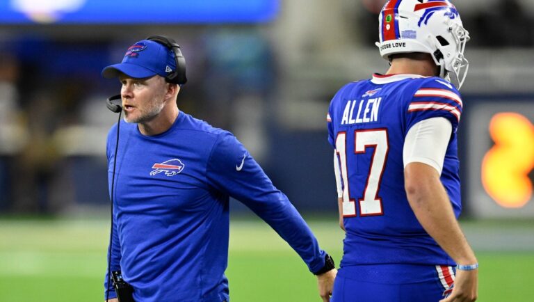 Quarterback Josh Allen (17) runs past Buffalo Bills head coach Sean McDermott during an NFL football game Thursday, Sept. 8, 2021, in Inglewood, Calif. (AP Photo/John McCoy)