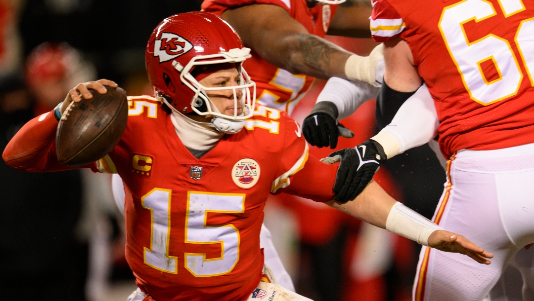 Kansas City Chiefs quarterback Patrick Mahomes (15) tries to escape pressure