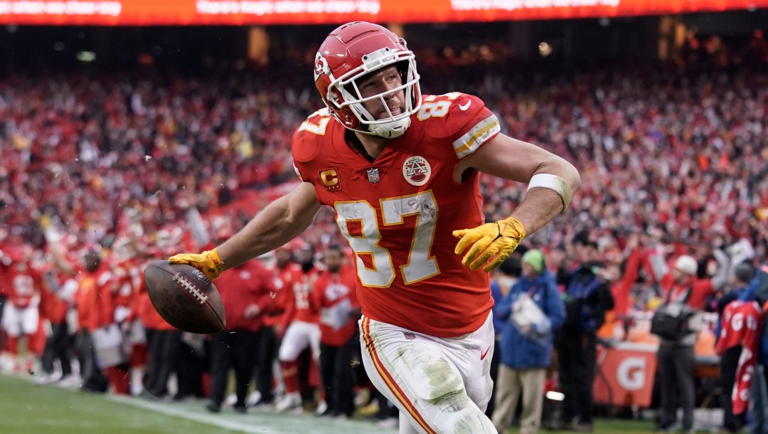 Kansas City Chiefs tight end Travis Kelce scores a touchdown against the Jacksonville Jaguars during an NFL Divisional Playoff football game Saturday, Jan. 21, 2023, in Kansas City, Mo. (AP Photo/Ed Zurga)
