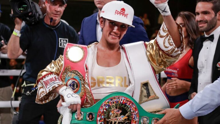 Amanda Serrano poses for photographs after defeating Heather Hardy in a boxing bout Friday, Sept. 13, 2019, in New York.