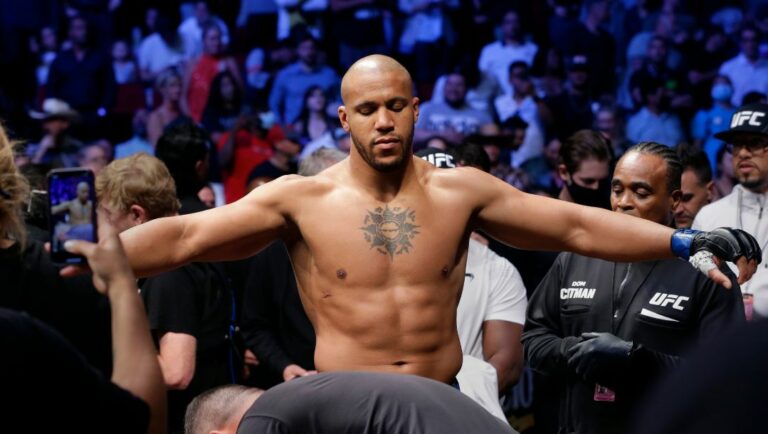 Ciryl Gane is checked over by officials before entering the octagon with Derrick Lewis for their interim heavyweight.