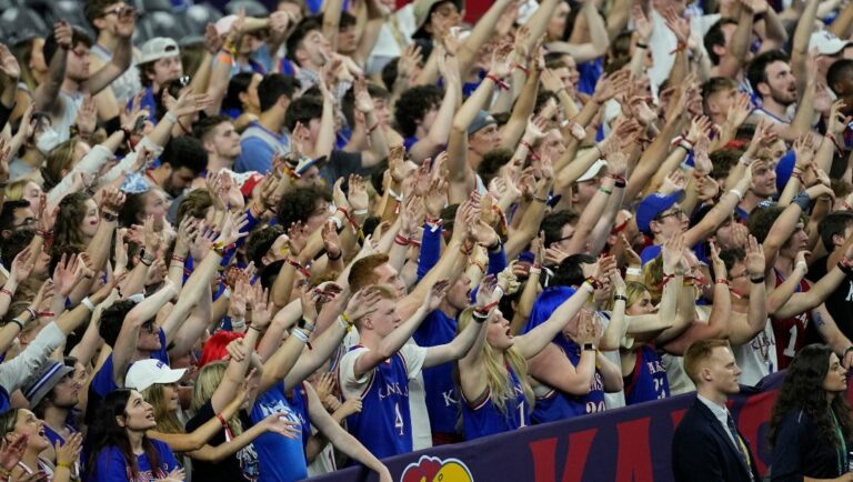 Kansas fans cheer during the first half of a college basketball game against Kansas in the finals of the Men's Final Four NCAA tournament, Monday, April 4, 2022, in New Orleans.