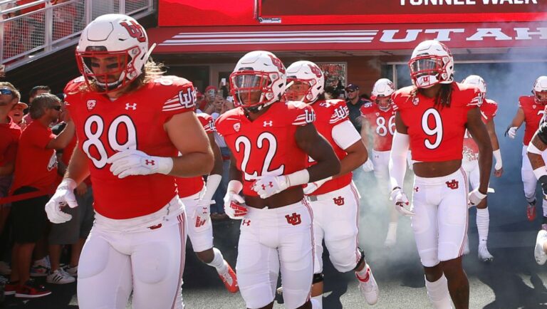 Utah cornerback Aaron Lowe (22) runs with his teammates onto the field before an NCAA college football game against Washington State Saturday, Sept. 25, 2021, in Salt Lake City, Utah.