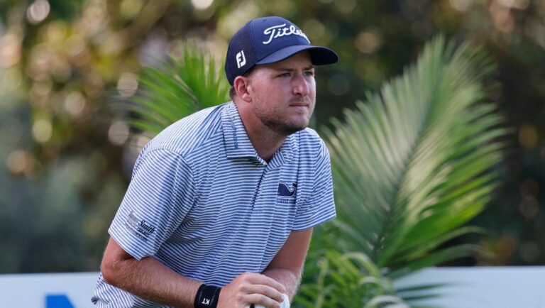 Lee Hodges watches his tee shot on the eighth hole during the second round of the Wyndham Championship golf tournament, Friday, Aug. 5, 2022, in Greensboro, N.C.