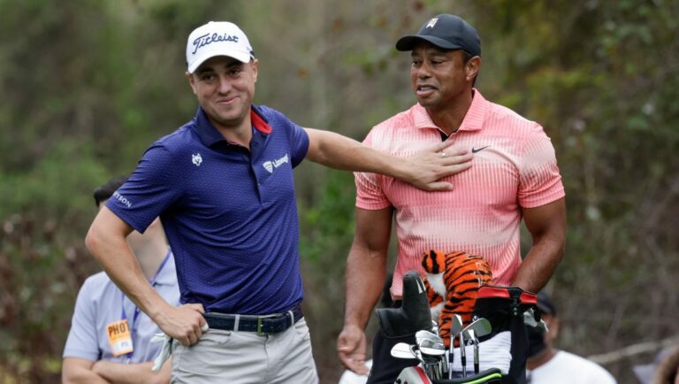 Tiger Woods, right, and Justin Thomas, left, have a laugh on the 13th hole during the first round of the PNC Championship golf tournament Saturday, Dec. 17, 2022, in Orlando, Fla.