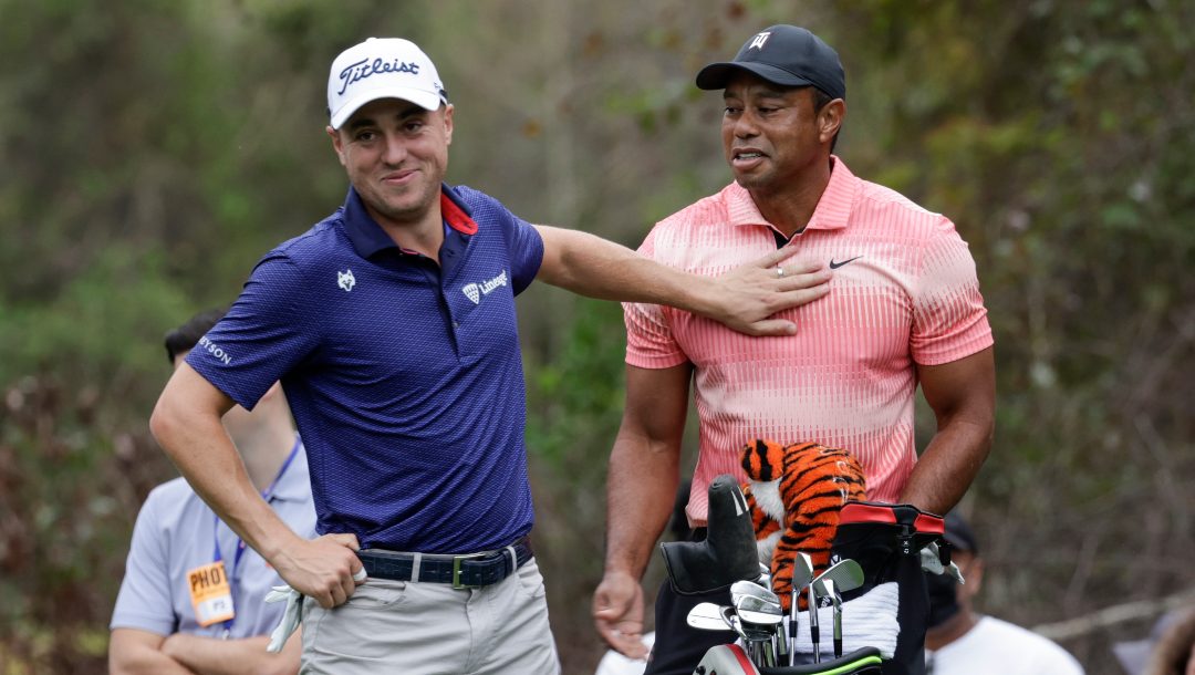 Tiger Woods, right, and Justin Thomas, left, have a laugh on the 13th hole during the first round of the PNC Championship golf tournament Saturday, Dec. 17, 2022, in Orlando, Fla.