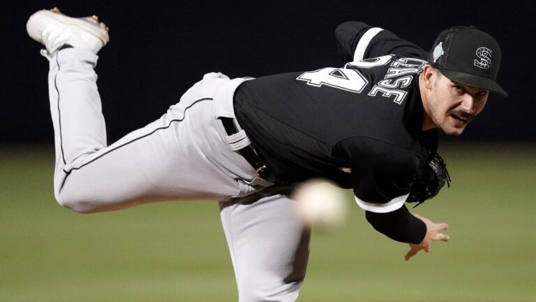 Chicago White Sox starting pitcher Dylan Cease throws during the second inning of a spring training baseball game against the Seattle Mariners Friday, March 25, 2022, in Peoria, Ariz.