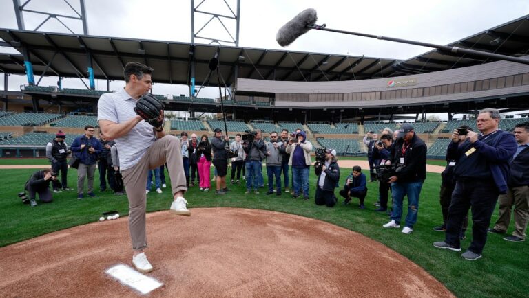 Major League Baseball Vice President of On-Field Strategy Joe Martinez demonstrates some of the new rule changes the 2023 season Tuesday, Feb. 14, 2023, in Scottsdale, Ariz. Opening day will feature three of the biggest changes in baseball since 1969: Two infielders will be required to be on either side of second base, base size will increase to 18-inch squares from 15 and a pitch clock will be used. (AP Photo/Morry Gash)
