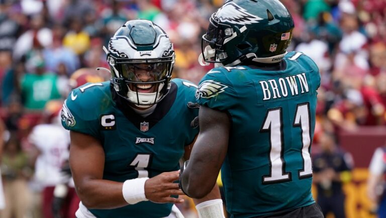 Philadelphia Eagles wide receiver A.J. Brown (11) and quarterback Jalen Hurts (1) celebrate