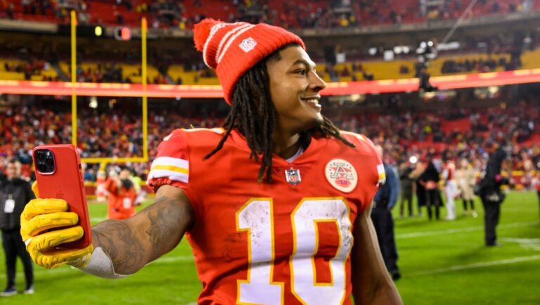 Kansas City Chiefs running back Isiah Pacheco does a social media post after their victory against the Jacksonville Jaguars in an NFL divisional round playoff football game, Saturday, Jan. 21, 2023 in Kansas City, Mo. (AP Photo/Reed Hoffmann)