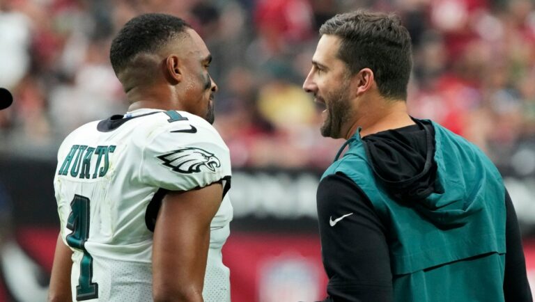 Philadelphia Eagles quarterback Jalen Hurts (1) speaks with head coach Nick Sirianni during the first half an NFL football game against the Arizona Cardinals, Sunday, Oct. 9, 2022, in Glendale, Ariz. (AP Photo/Rick Scuteri)