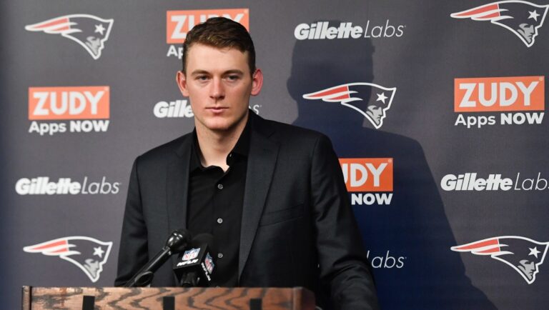 New England Patriots quarterback Mac Jones (10) speaks during a news conference after their NFL football game against the Buffalo Bills, Sunday, Jan. 8, 2023, in Orchard Park. (AP Photo/Adrian Kraus)
