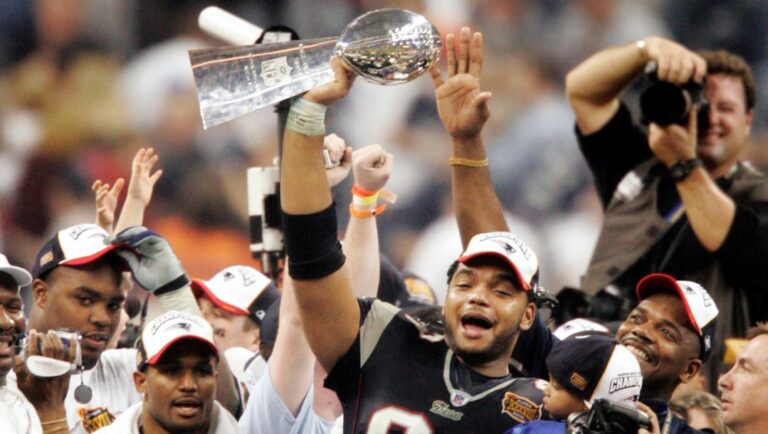 FILE - New England Patriots' Richard Seymour (93) holds the Vince Lombardi trophy after the Patriots defeated the Carolina Panthers 32-29 to win Super Bowl XXXVIII on Feb. 1, 2004, in Houston. Seymour's winning start in New England is a good starting point for how the defensive lineman ended up in the Pro Football Hall of Fame. The Patriots won the Super Bowl in three of Seymour's first four seasons. (AP Photo/Michael Conroy, File)