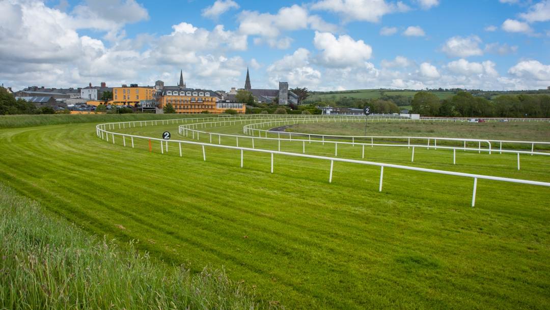 A turn on an empty horse racing track.