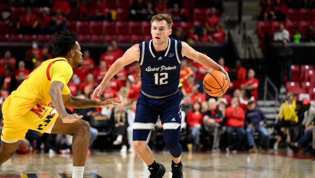 Saint Peter's guard Kyle Cardaci (12) in action during the first half of an NCAA college basketball game against Maryland, Thursday, Dec. 22, 2022, in College Park, Md.