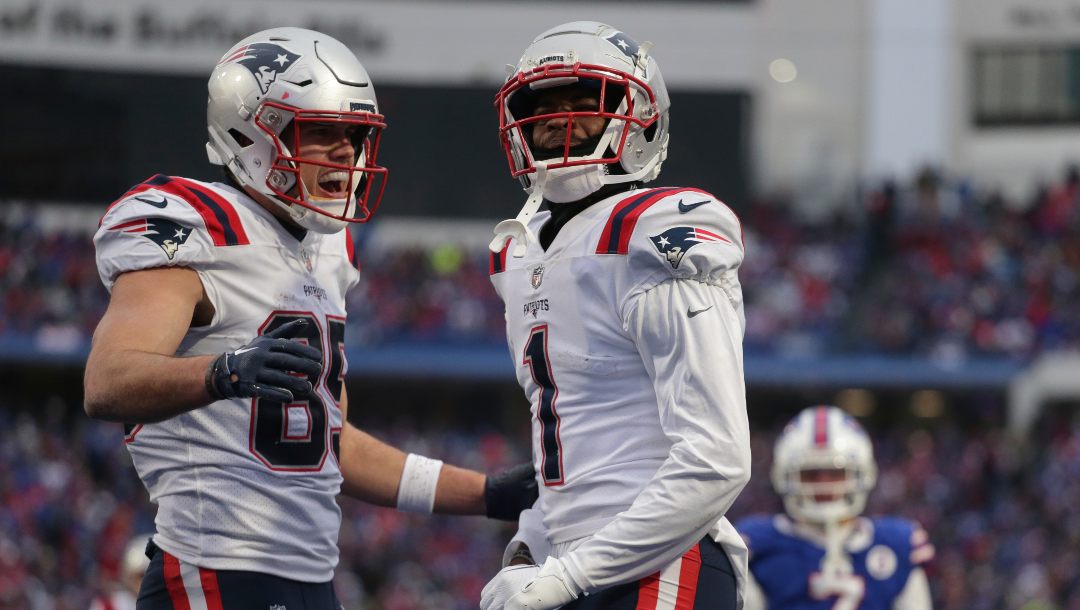 New England Patriots tight end Hunter Henry (85) and wide receiver DeVante Parker (1) celebrate a touchdown during the second half of an NFL football game against the Buffalo Bills on Sunday, Jan. 8, 2023, in Orchard Park, N.Y.