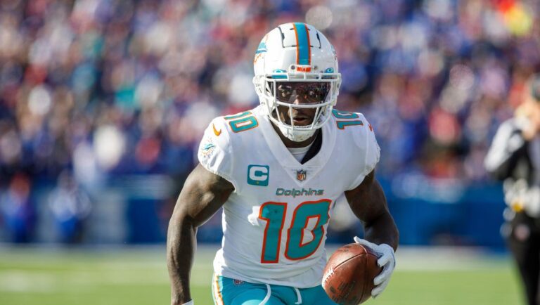 Miami Dolphins wide receiver Tyreek Hill (10) goes out of bounds after a catch during an NFL wild-card football game Sunday, Jan. 15, 2023, in Orchard Park, NY.