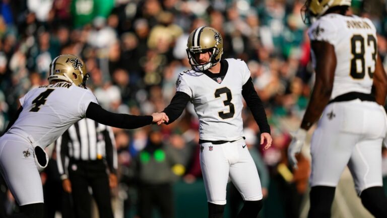 New Orleans Saints holder Blake Gillikin (4) congratulates place kicker Wil Lutz (3) after kicking a field goal in the first half of an NFL football game against the Philadelphia Eagles in Philadelphia, Sunday, Jan. 1, 2023