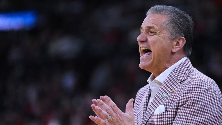 Arkansas head coach John Calipari calls to his players during the first half in the second round of the NCAA college basketball tournament, Saturday, March 22, 2025, in Providence, R.I. (AP Photo/Charles Krupa)