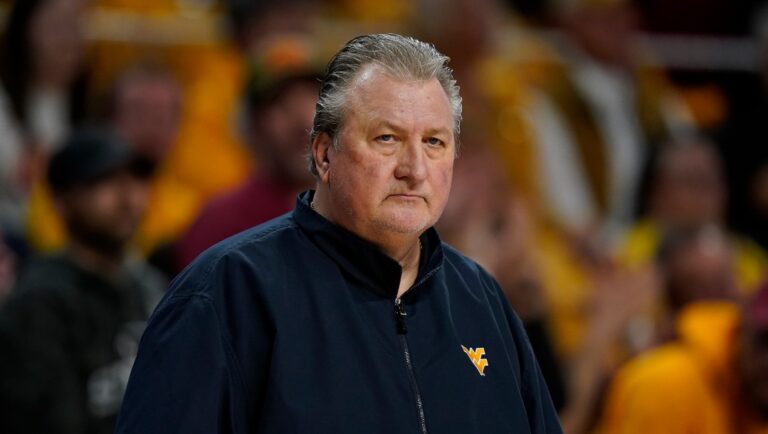 West Virginia head coach Bob Huggins watches from the bench during the first half of an NCAA college basketball game against Iowa State, Monday, Feb. 27, 2023, in Ames, Iowa. (AP Photo/Charlie Neibergall)