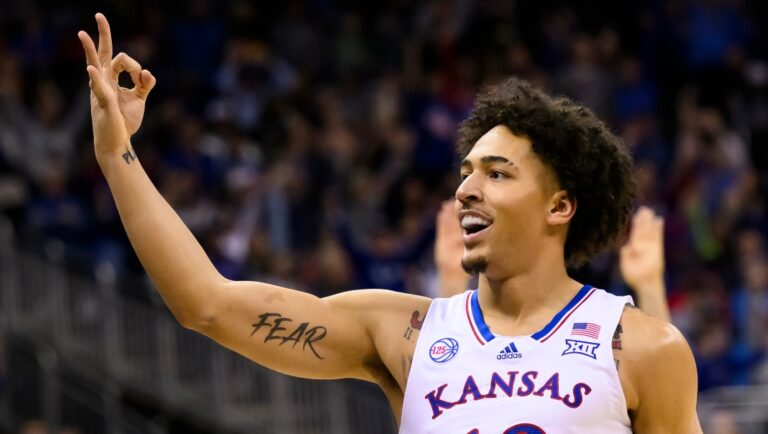 Kansas forward Jalen Wilson celebrates after hitting a three-point basket during the first half of an NCAA college basketball game against Iowa State in the semifinal round of the Big 12 Conference tournament Friday, March 10, 2023, in Kansas City, Mo. (AP Photo/Reed Hoffmann)