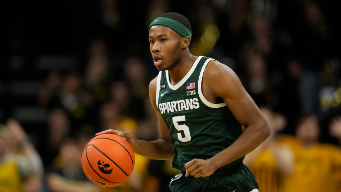 Michigan State guard Tre Holloman drives up court during an NCAA college basketball game against Iowa, Saturday, Feb. 25, 2023, in Iowa City, Iowa. (AP Photo/Charlie Neibergall)