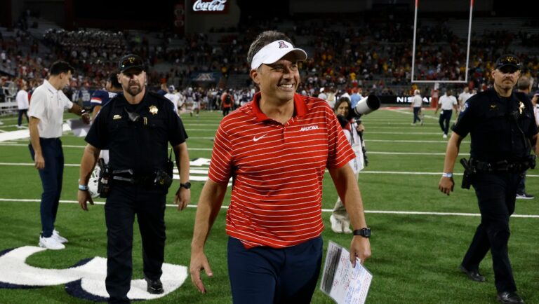 Arizona head coach Jedd Fisch smiles after Arizona beat North Dakota State in an NCAA college football game Saturday, Sept. 17, 2022, in Tucson, Ariz. (AP Photo/Chris Coduto)