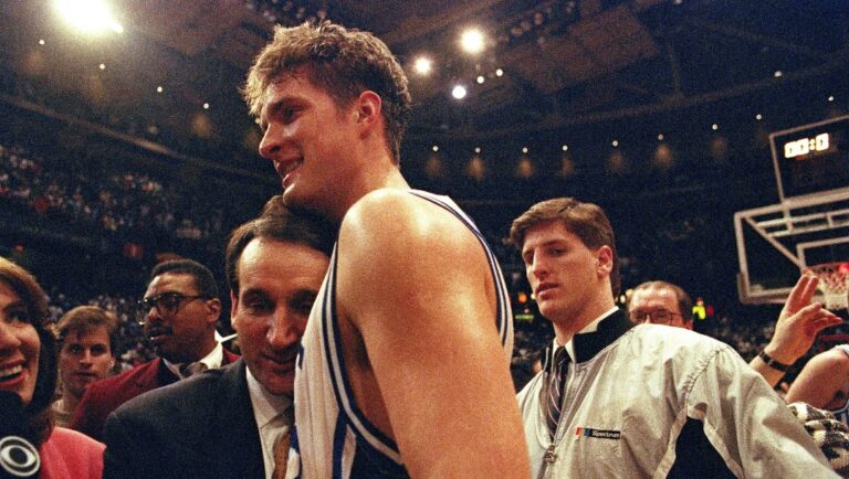 FILE - In this March 28, 1992, file photo, Duke University basketball head coach Mike Krzyzewski hugs his star center Christian Laettner after Duke defeated Kentucky in overtime 104-103 to win NCAA East Regional Final in Philadelphia. (AP Photo/Amy Sancetta, File)
