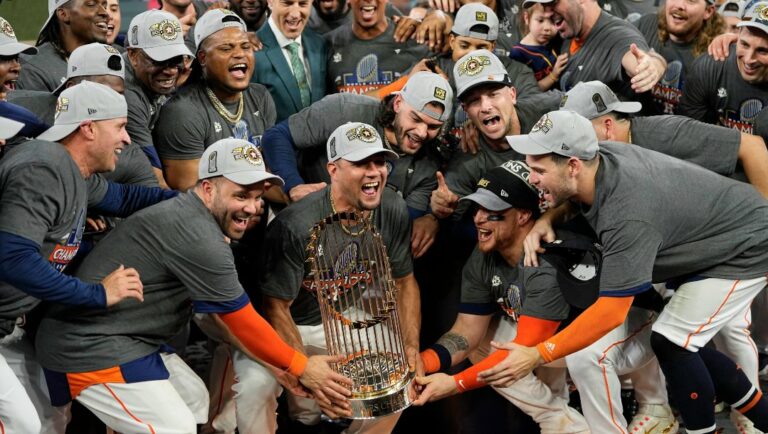 The Houston Astros celebrate with the trophy after their 4-1 World Series win against the Philadelphia Phillies in Game 6 on Saturday, Nov. 5, 2022, in Houston.