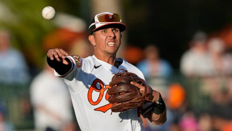 Baltimore Orioles third baseman Ramon Urias throws out Toronto Blue Jays Leo Jimenez to end the second inning of a spring training baseball game in Sarasota, Fla., Thursday, March 16, 2023. (AP Photo/Gerald Herbert)