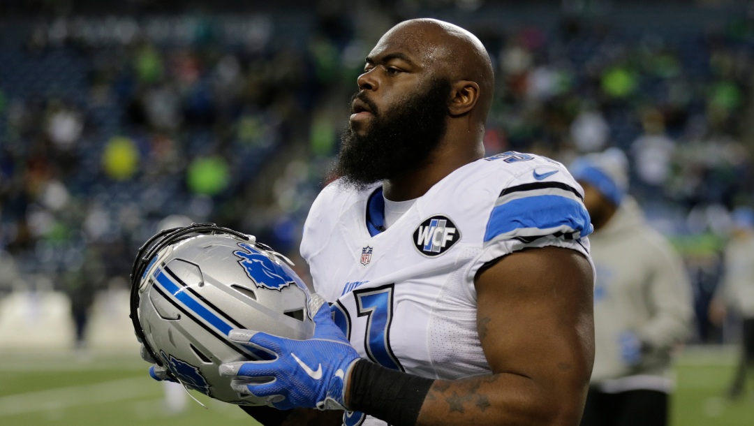 Detroit Lions defensive tackle A'Shawn Robinson holds his helmet during warmups before an NFL football NFC wild card playoff game against the Seattle Seahawks, Saturday, Jan. 7, 2017, in Seattle. (AP Photo/Stephen Brashear)