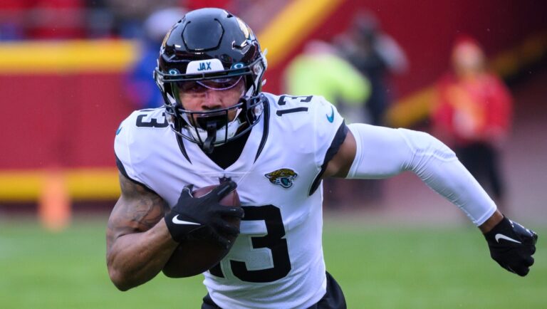 Jacksonville Jaguars wide receiver Christian Kirk carries the ball