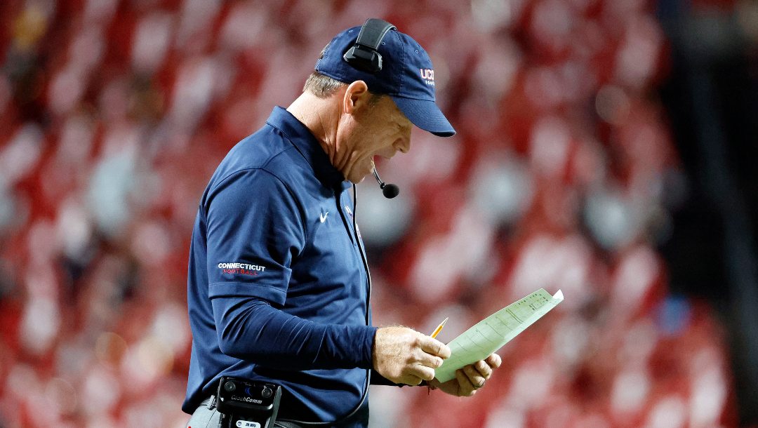 Connecticut head coach Jim L. Mora coaches from the sidelines against North Carolina State during the first half of an NCAA college football game in Raleigh, N.C., Saturday, Sept. 24, 2022.