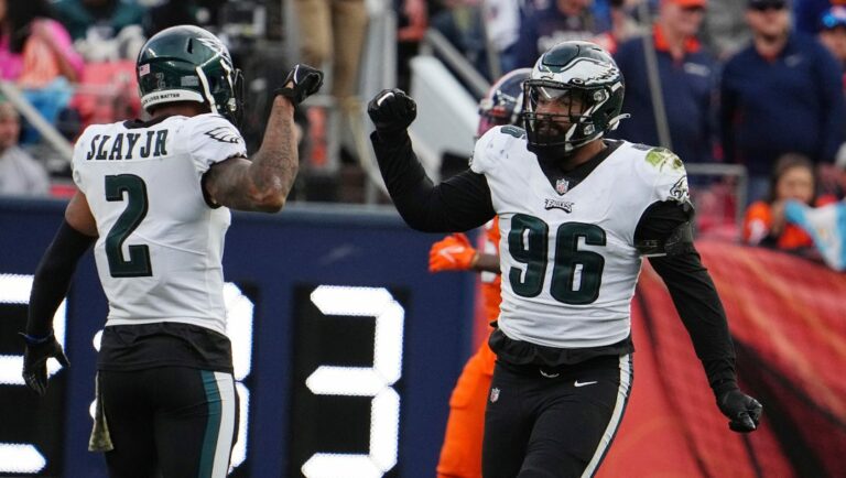 Philadelphia Eagles cornerback Darius Slay (2) and Philadelphia Eagles defensive end Derek Barnett (96) celebrate against the Denver Broncos in the first half of an NFL football game Sunday, Nov 14, 2021, in Denver.