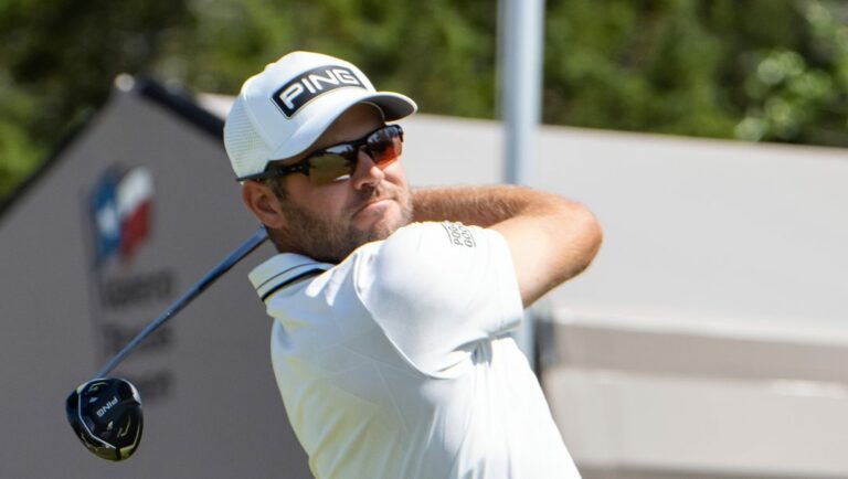 Corey Conners watches his tee shot on the first hole during the third round of the Valero Texas Open golf tournament in San Antonio, Saturday, April 1, 2023.