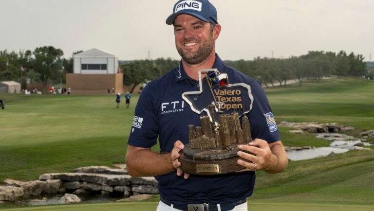 Corey Conners holds the Valero Texas Open trophy after winning the golf tournament in San Antonio, Sunday, April 2, 2023.