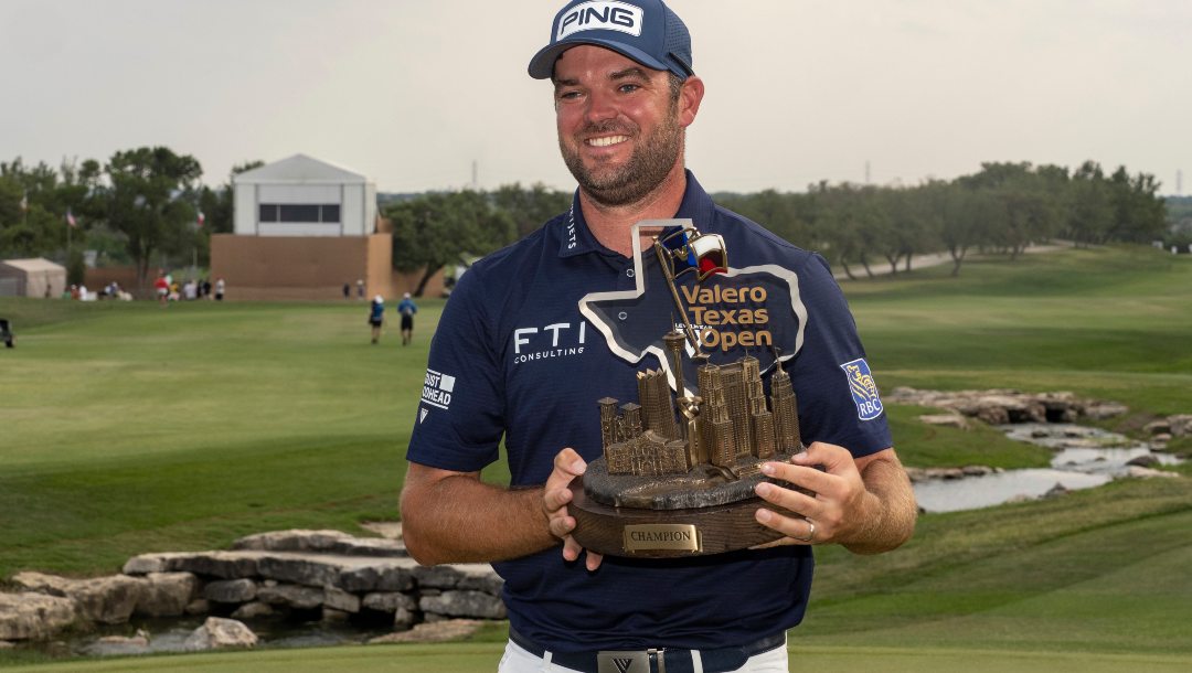 Corey Conners holds the Valero Texas Open trophy after winning the golf tournament in San Antonio, Sunday, April 2, 2023.