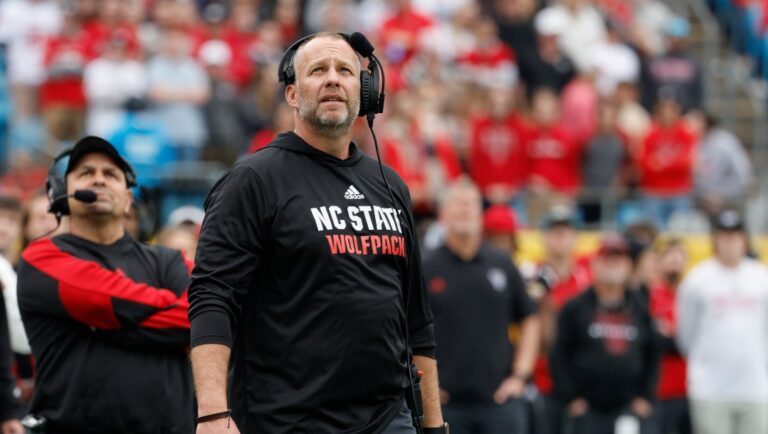 North Carolina State head coach Dave Doeren watches a replay as his team plays against Maryland in the Duke's Mayo Bowl NCAA college football game in Charlotte, N.C., Friday, Dec. 30, 2022. Maryland defeated North Carolina State 16-12. (AP Photo/Nell Redmond)